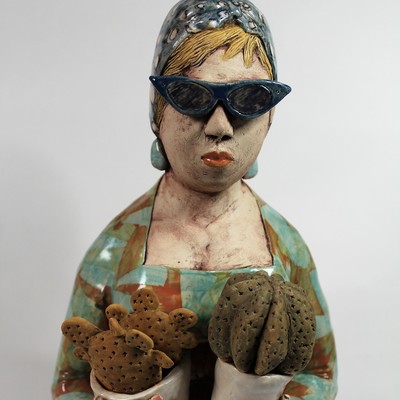 White Stoneware Figure of a Woman holding Cacti