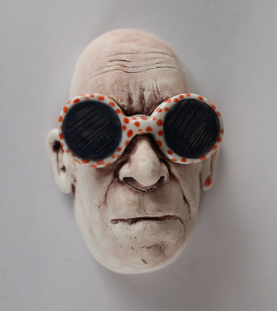 Porcelain Wall Hanging Man wearing sunglasses