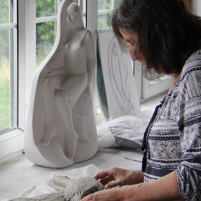 Pam sculpting a figure